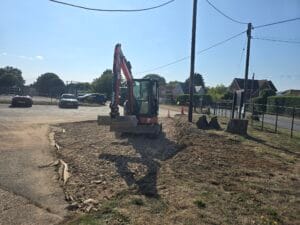 Car Park with a digger working on laying a new surface